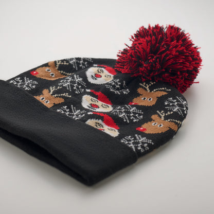 Weihnachtliche Strickmütze mit Bündchen und Bommel aus weichem elastischem Acryl.