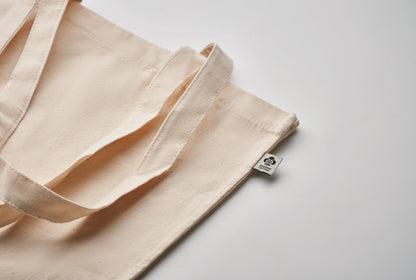 Einkaufstasche aus Organic Cotton mit langen Tragegriffen und Bodenfalz. 220 g/m².