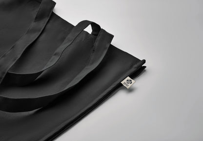 Einkaufstasche aus Organic Cotton mit langen Tragegriffen und Bodenfalz. 220 g/m².