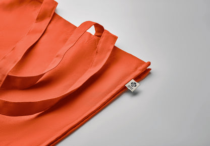 Einkaufstasche aus Organic Cotton mit langen Tragegriffen und Bodenfalz. 220 g/m².