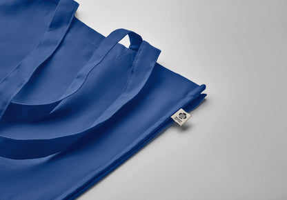 Einkaufstasche aus Organic Cotton mit langen Tragegriffen und Bodenfalz. 220 g/m².