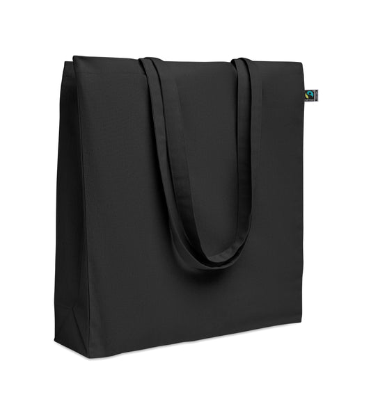Einkaufstasche aus Fairtrade-Baumwolle mit langen Tragegriffen und Bodenfalz. 180 g/m².