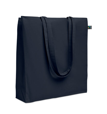 Einkaufstasche aus Fairtrade-Baumwolle mit langen Tragegriffen und Bodenfalz. 180 g/m².