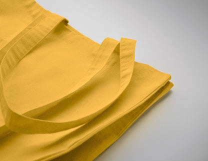 Einkaufstasche aus Fairtrade-Baumwolle mit langen Tragegriffen und Bodenfalz. 180 g/m².