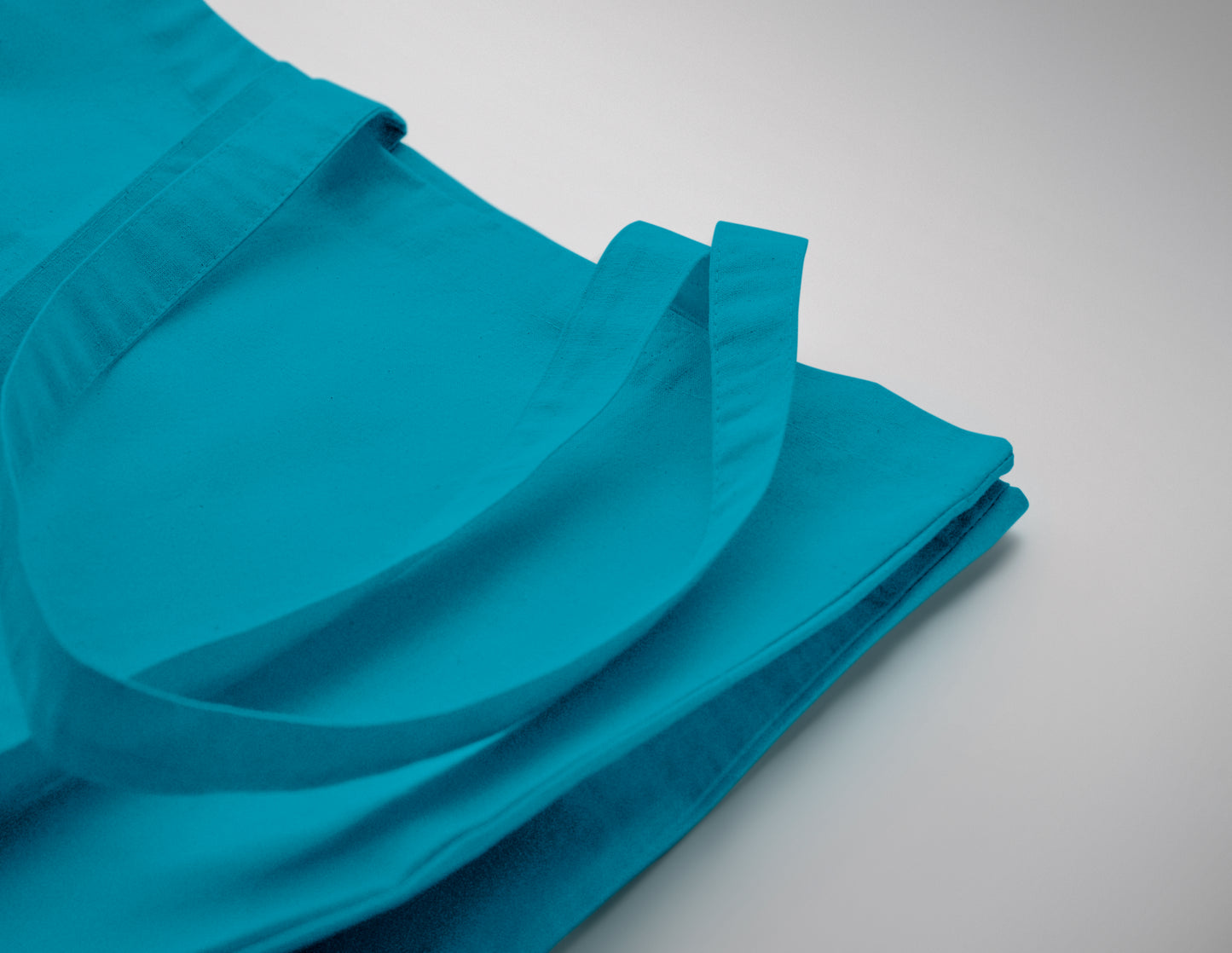 Einkaufstasche aus Fairtrade-Baumwolle mit langen Tragegriffen und Bodenfalz. 180 g/m².