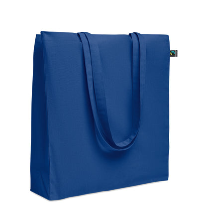 Einkaufstasche aus Fairtrade-Baumwolle mit langen Tragegriffen und Bodenfalz. 180 g/m².