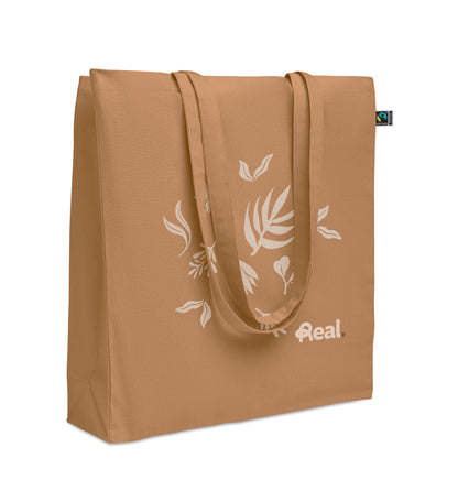 Einkaufstasche aus Fairtrade-Baumwolle mit langen Tragegriffen und Bodenfalz. 180 g/m².