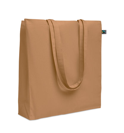 Einkaufstasche aus Fairtrade-Baumwolle mit langen Tragegriffen und Bodenfalz. 180 g/m².
