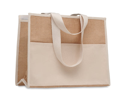 Diese Shopping Tasche aus Jute hat lange Tragegriffe. Das Innere ist laminiert