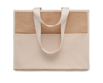 Diese Shopping Tasche aus Jute hat lange Tragegriffe. Das Innere ist laminiert